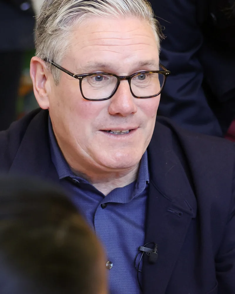 Before: Keir Starmer, greying hair and rectangular glasses.